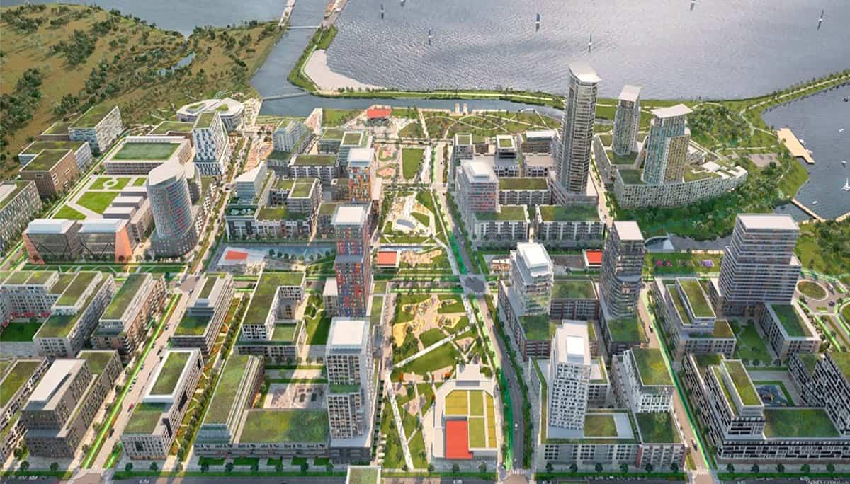 Bird’s-eye view of Aura Lakeview Village with townhomes, lakefront, and nearby neighborhood amenities.